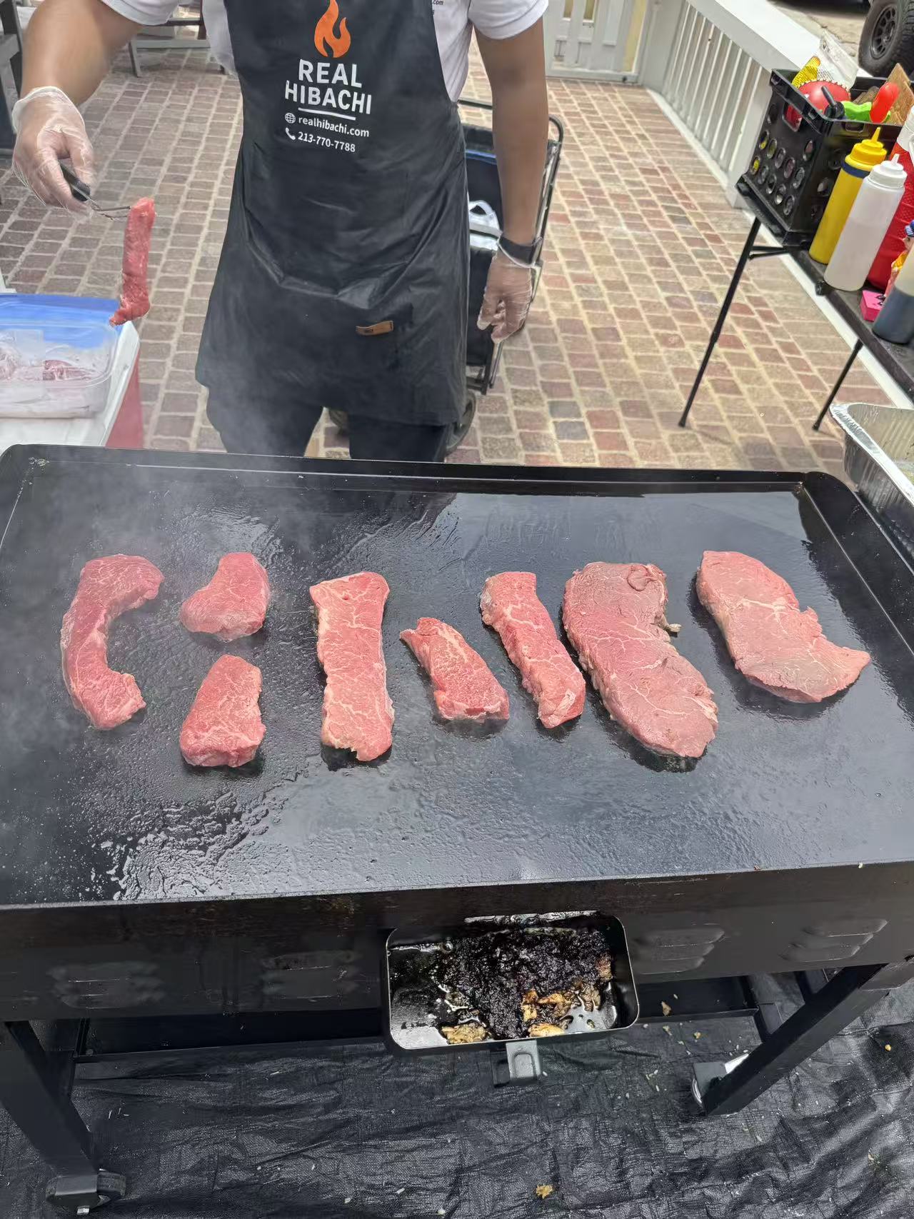 Skilled hibachi chef demonstrating cooking techniques for Los Angeles home entertainment